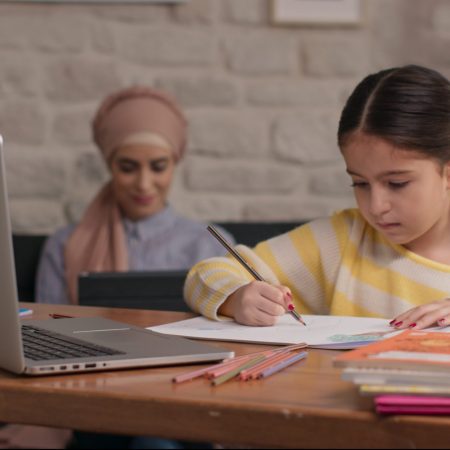 Little,Schoolgirl,Video,Conference,E-learning,With,Teacher,And,Classmates,On